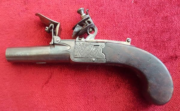 A good English Flintlock boxlock miniature muff pistol by Holmes. Concealed drop down trigger. Circa 1800. Good condition. Ref 9531.